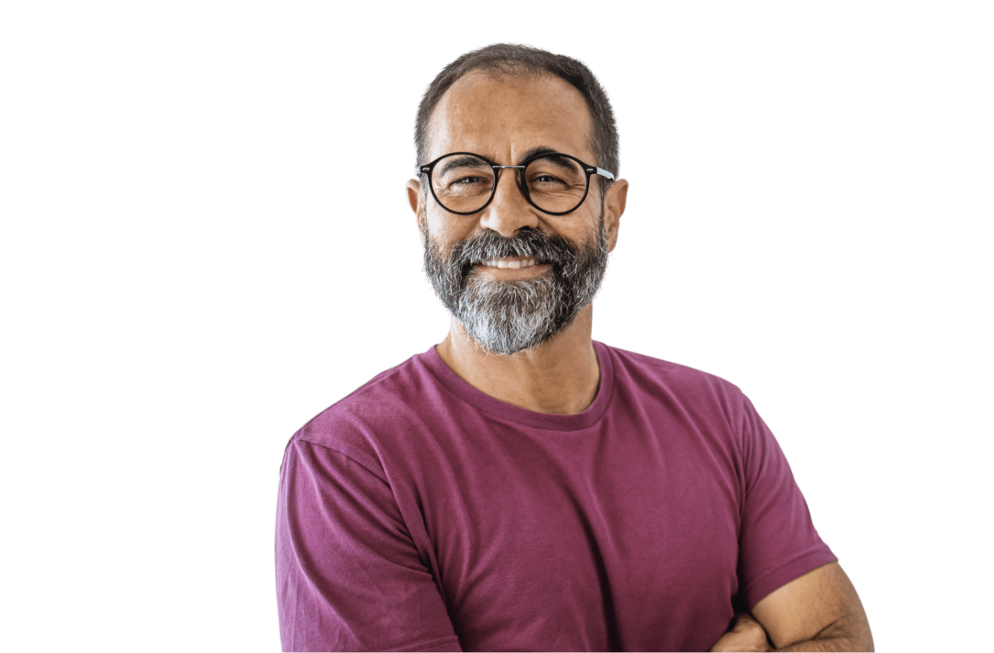 Man in maroon t-shirt with glasses and a beard smiling with his arms folded